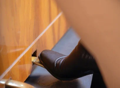 Woman In Shoes Pressing Yamaha Piano Pedal